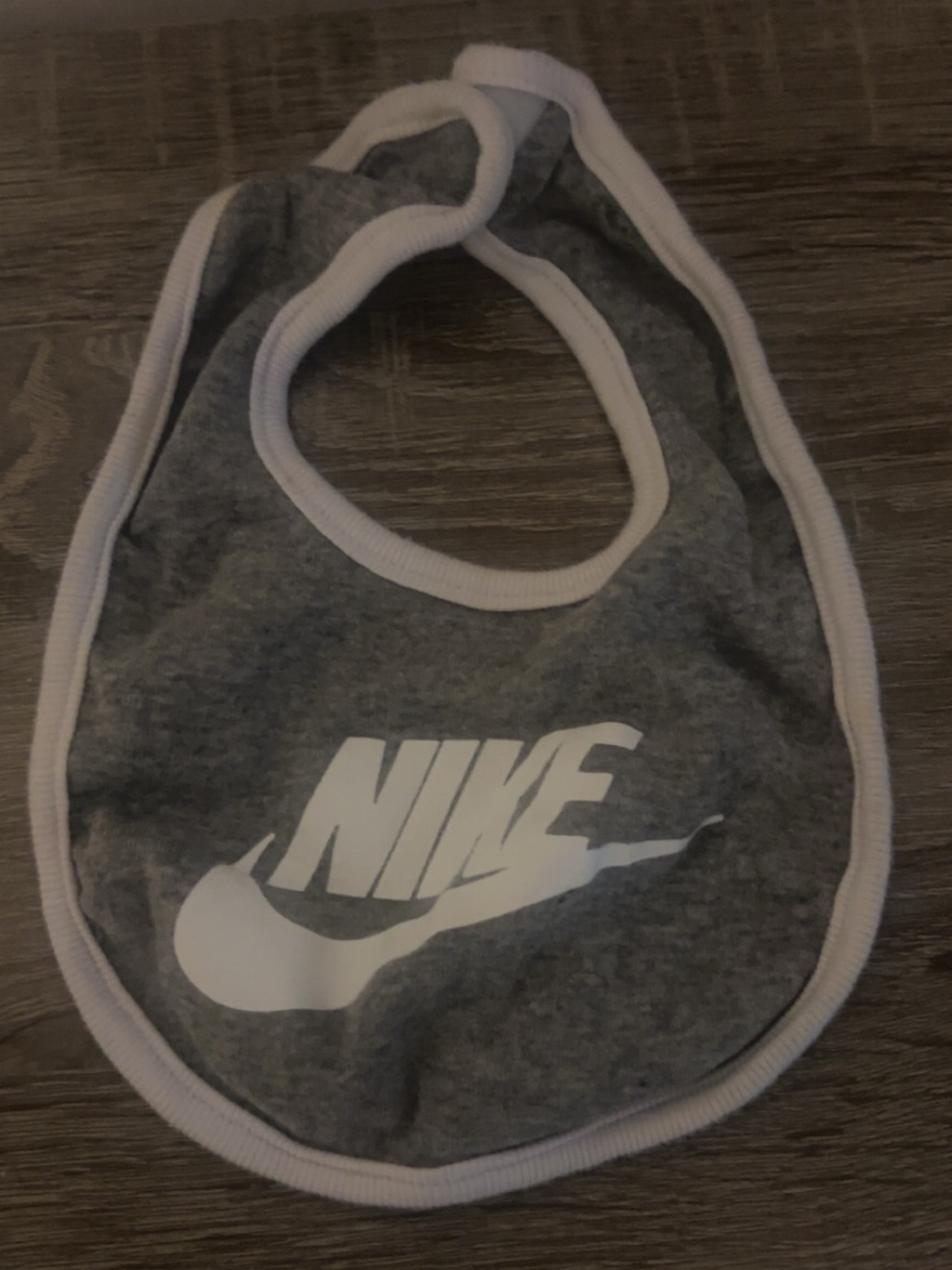 Nike Gray Baby Bib with White Logo Trim